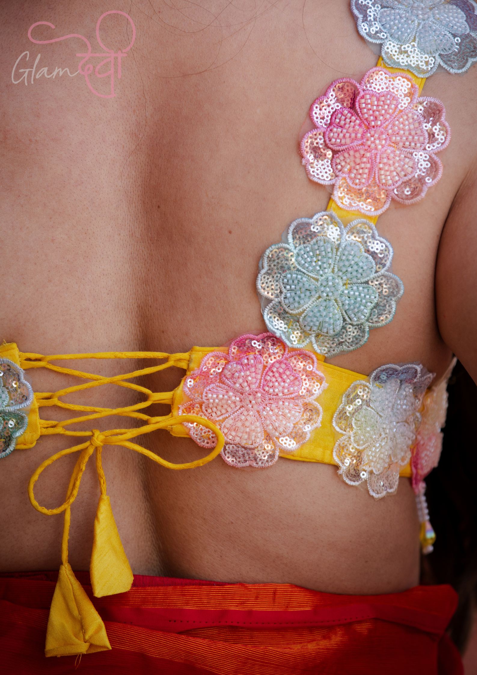 Yellow Sleeveless Silk Blouse with 3D Floral Appliqué & Dori Tie-Up Back | Festive Wear | Glam Devi